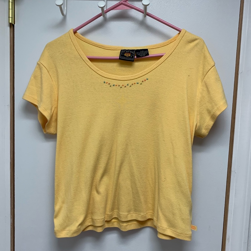 yellow tee with embroidered flowers